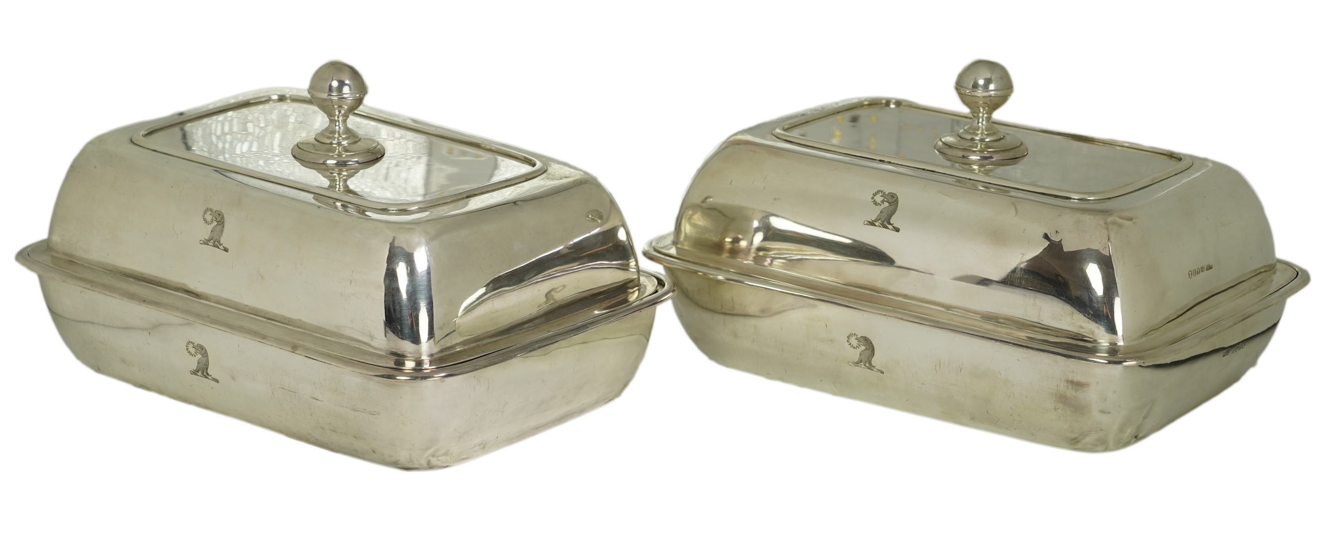A pair of George IV silver entrée dishes and covers with handles, by John Edward Terry, engraved with the Tregonwell family crest